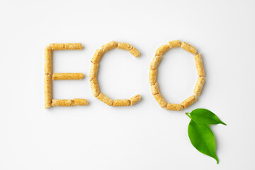 Wood pellets formed in word 'ECO' isolated on white background
