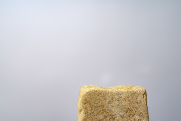 Stone podium mockup against gray background copy space