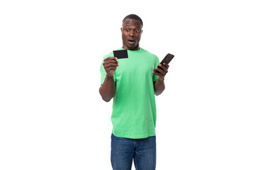 young charismatic energetic american guy promoter holding credit card with mockup