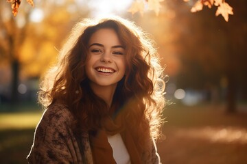 Realistic portrait of a young happy smiling woman in an autumn park, captured with the essence of golden-hour sunlight