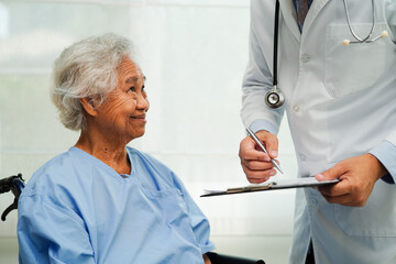 Doctor checking and note diagnosis medicine in clipboard of patients in hospital.