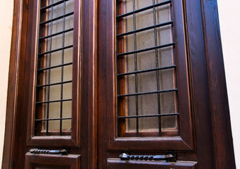 Wooden entrance doors with glass