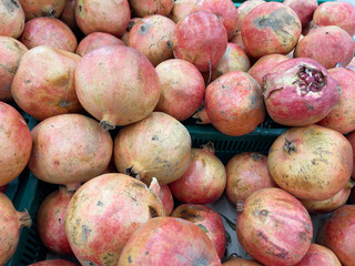 Pomegranate fruit in the market, closeup of photo.