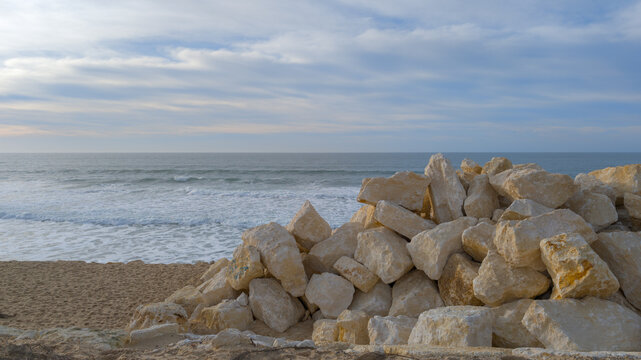 stone wall to combat coastal erosion on the beach in Lacanau Ocean