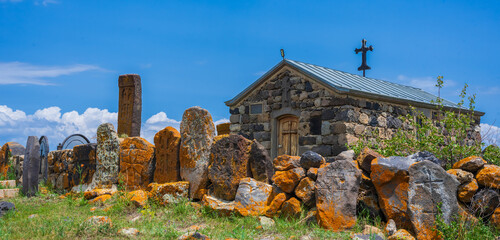 Artsvatrich Chapel on the shore of Lake Sevan, ancient khachkars with the image of a cross are...