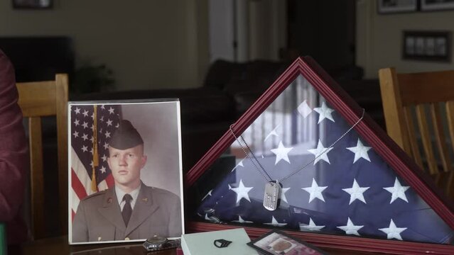 Military veteran reflects on his life in retirement - flag, uniform, memorial, service