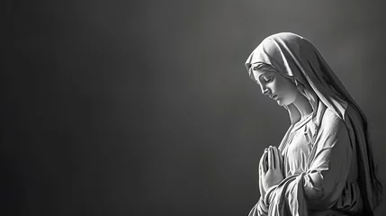 Fotobehang Christian Easter. Black and white image of a statue of the Virgin Mary. Space for text. © TopMicrobialStock