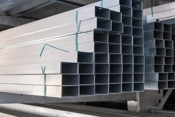 Stack of Building Material Aluminum Profile For Drywall At The Construction Work Site. For...