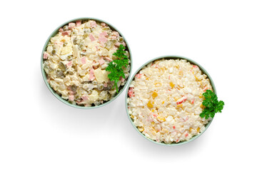 Olivier salad and crab stick salad isolated on white background. Salad plates top view.