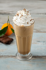 Orange and chocolate milkshake with coffee sprinkled on top