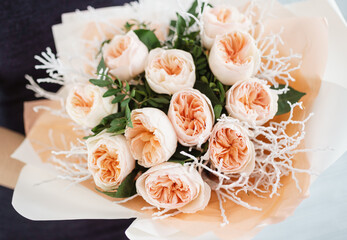 Peach Fuzz roses in the hands