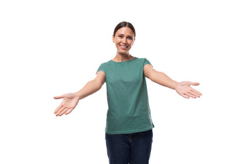 young happy brunette woman in t-shirt rejoices on white background with copy space