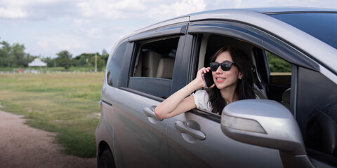 Young Asian woman enjoy and fun outdoors lifestyle road trip in forest on summer travel vacation