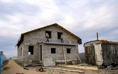 construction of a private house from silicate blocks on a summer cottage on an autumn day