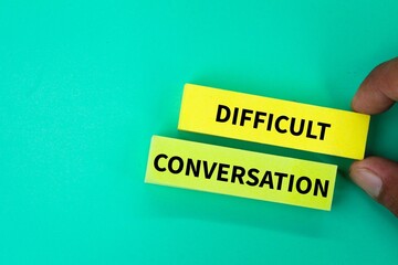 colored paper with the word DIFFICULT CONVERSATION. difficult conversation concepts