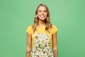 Young smiling happy cheerful blonde housewife housekeeper chef cook baker woman she wear apron...