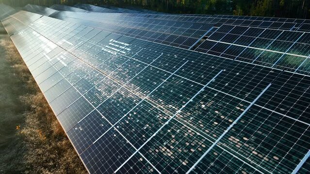 Solar panels absorbing sun energy at a sunlight power field - CGI render Aerial