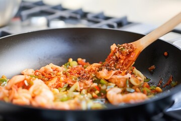 cooking batter pour on a skillet with kimchi pieces - obrazy, fototapety, plakaty