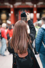 Tourist woman visit Sensoji Temple or Asakusa Kannon Temple is a Buddhist temple located in Asakusa. Landmark and popular for tourist attraction and Travel destination in Tokyo, Japan and Asia concept
