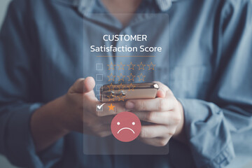 Customer using mobile smartphone for giving review the service score with one star dissatisfied...