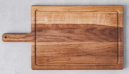Chopping board. Wooden cutting board on gray concrete stone background. Top view, copy space.