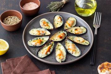 Baked mussels with cheese and herbs. Seafood. Healthy eating.