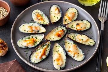 Baked mussels with cheese and herbs. Seafood. Healthy eating.