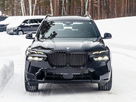 Novosibirsk, Russia - January  05 , 2024: black  BMW X7 , parked of a city. No other car and people.