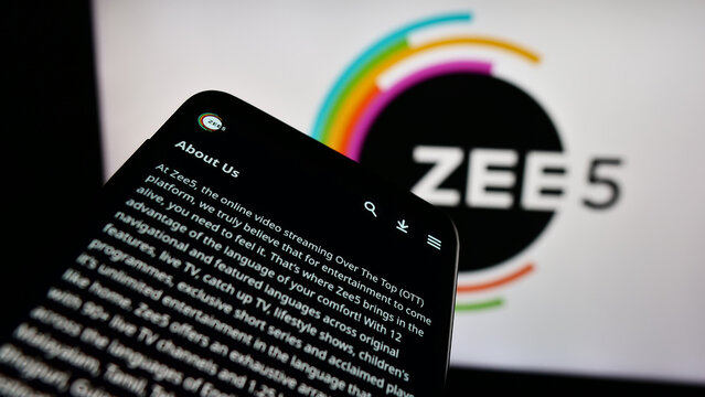 Stuttgart, Germany - 12-27-2023: Smartphone with website of Indian video streaming platform company ZEE5 in front of business logo. Focus on top-left of phone display.