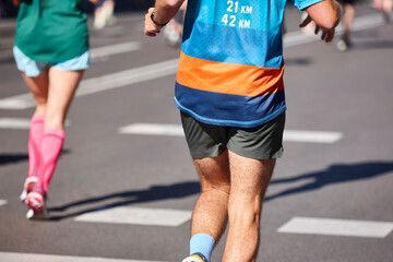 Fototapeta premium Runners on the street. Healthy lifestyle. Jogging exercise. Athletics