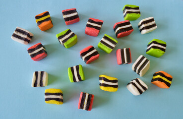 Licorice allsorts against a colorful background