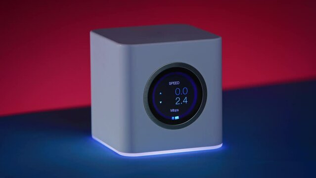 Ominous high end wifi router is showing download speed first go up or increase and then go down or decrease as connection slows down. Contrasty, moody subject with red background.