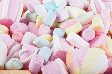 Multi-colored sweet marshmallows, top view. Marshmallows candy as background.
