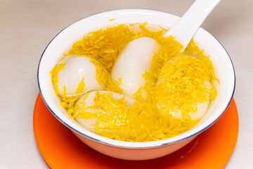 angle view bowl of Chrysanthemum Glutinous Rice Balls at horizontal composition
