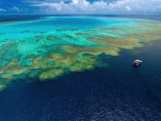 Boat at the  Bougainville reef in Coral Sea, Australia