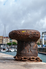 old rusty anchor on the pier