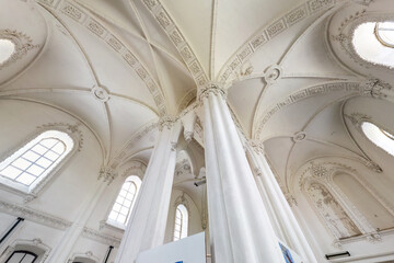 eclectic elements of the interior of a large choral Jewish synagogue with columns and decoration