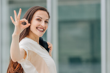business woman with okay gesture
