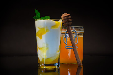 prepared homemade yogurt with natural honey in a glass
