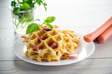 cooked fried potato waffles with sausage stuffing inside