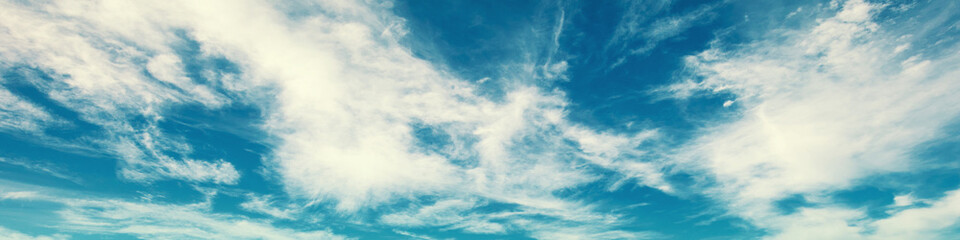 Blue sky with clouds. Cloudy sky background. Horizontal banner