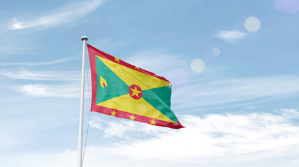 Grenada national flag cloth fabric waving on the sky - Image