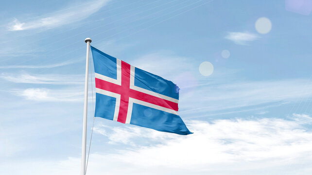 Iceland national flag cloth fabric waving on the sky - Image