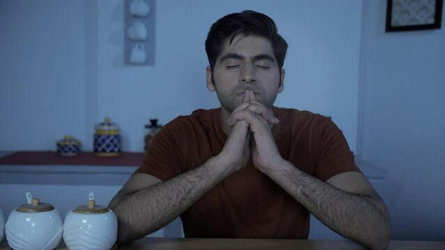 Portrait of a serious Indian male thinking about his future at night - overthinking  sleep disorder  depression. Young businessman struggling with stress - busy lifestyle concept  feeling anxious  ...