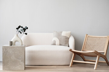 View of modern scandinavian style interior with sofa and trendy vase, Home staging and minimalism...