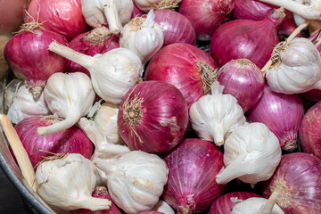 onion and garlic closeup on vintage wooden background, harvesting. Healthy food, vitamins