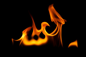 Hot flames on a black background. Beautiful flame of fire in the dark. Abstract of burning flames and smoke.
