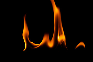 Hot flames on a black background. Beautiful flame of fire in the dark. Abstract of burning flames...