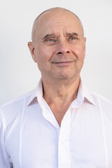 Fototapeta premium close-up of charismatic mature man, senior 60 years old looks carefully examines wrinkles on face, skin folds, age-related skin changes, aesthetic injection cosmetology, care anti-aging procedures