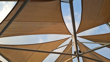 Canvas roof on steel structure, blue sky background